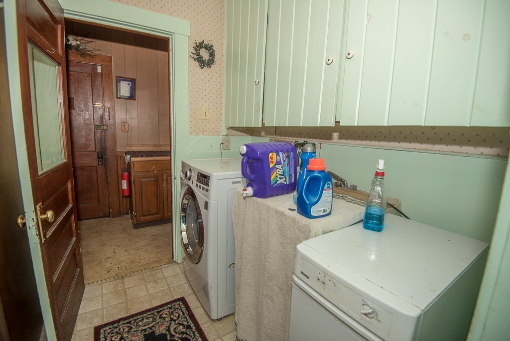 7-9 Boynton Street Clinton, MA 01510 - Photo 12 of 28 a bathroom with a sink and a washing machine