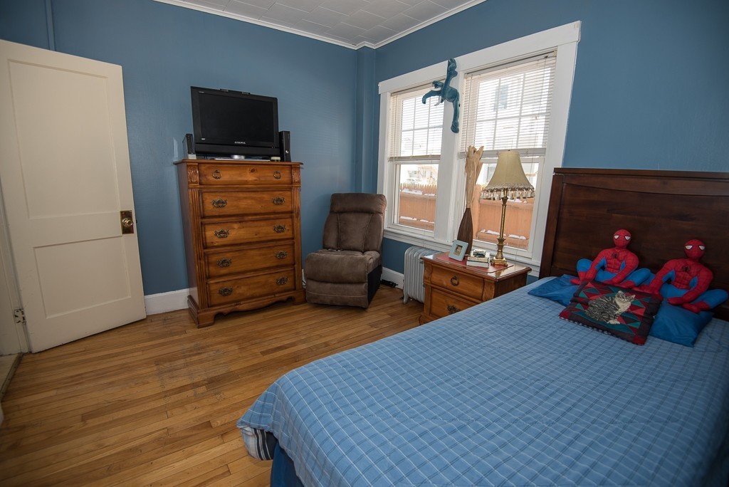 7-9 Boynton Street Clinton, MA 01510 - Photo 21 of 28 a bedroom with furniture and a flat screen tv