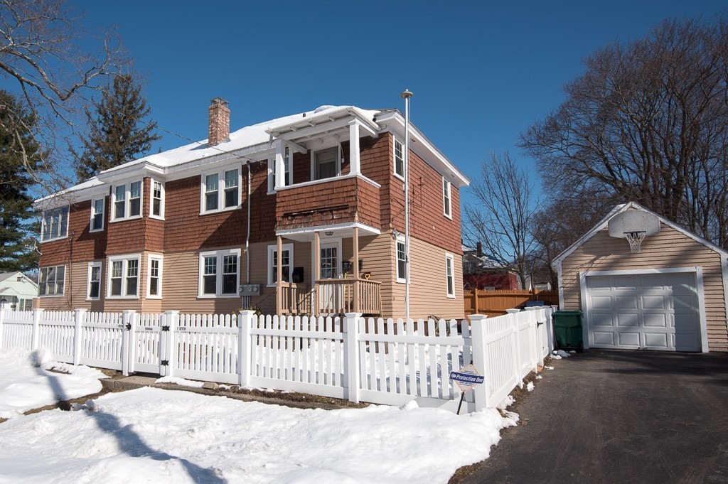 7-9 Boynton Street Clinton, MA 01510 - Photo 28 of 28 a front view of a house with a fence