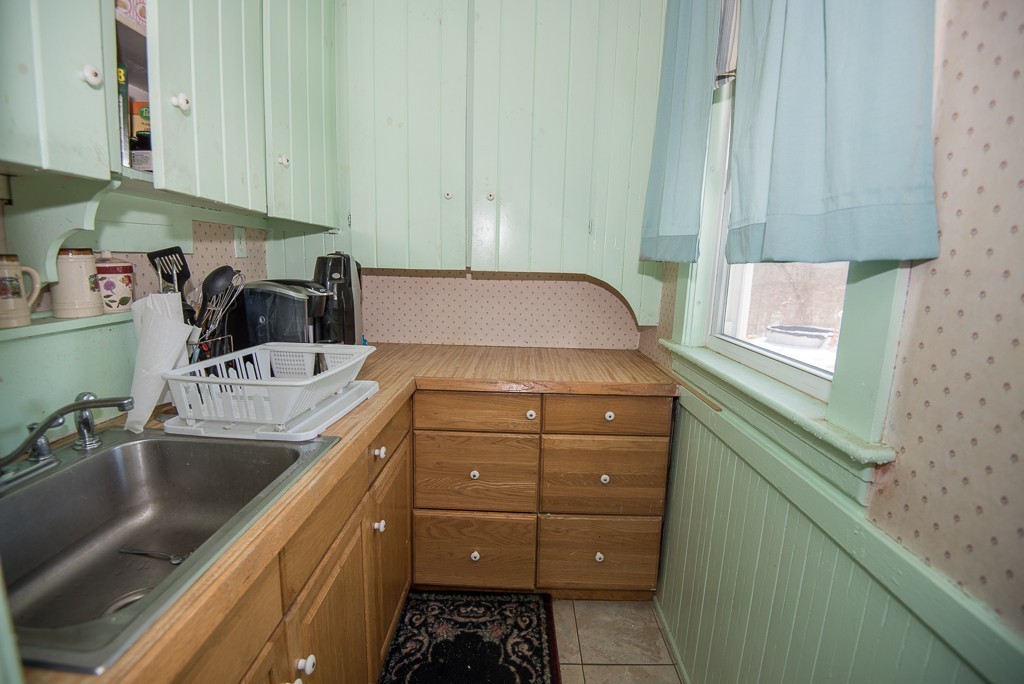 7-9 Boynton Street Clinton, MA 01510 - Photo 5 of 28 a kitchen with a sink and cabinets