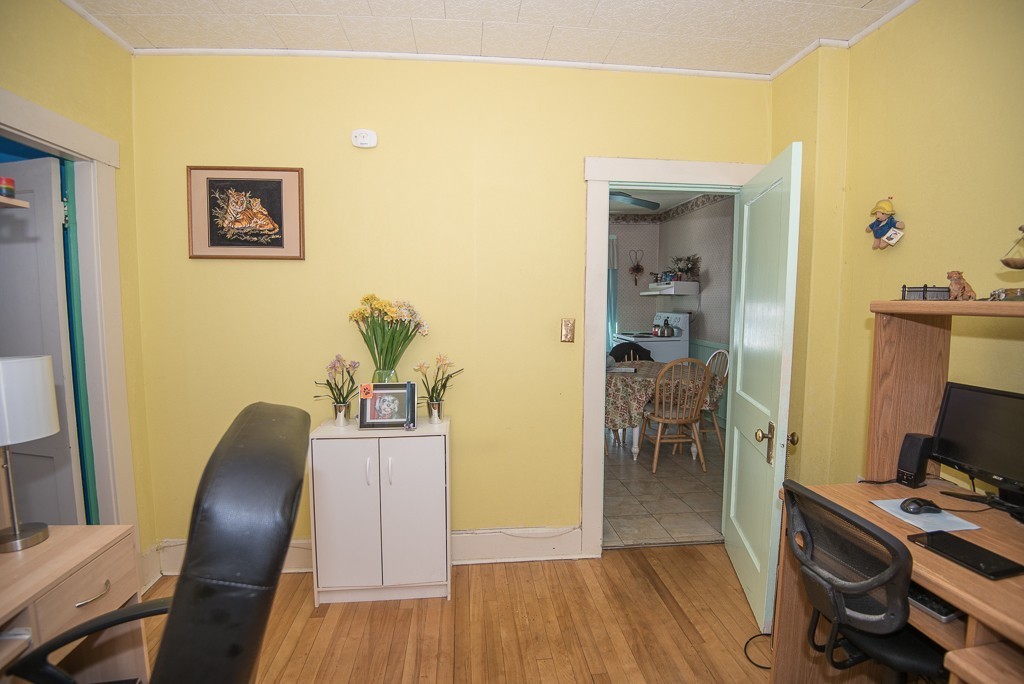 7-9 Boynton Street Clinton, MA 01510 - Photo 9 of 28 a view of a workspace with furniture and wooden floor