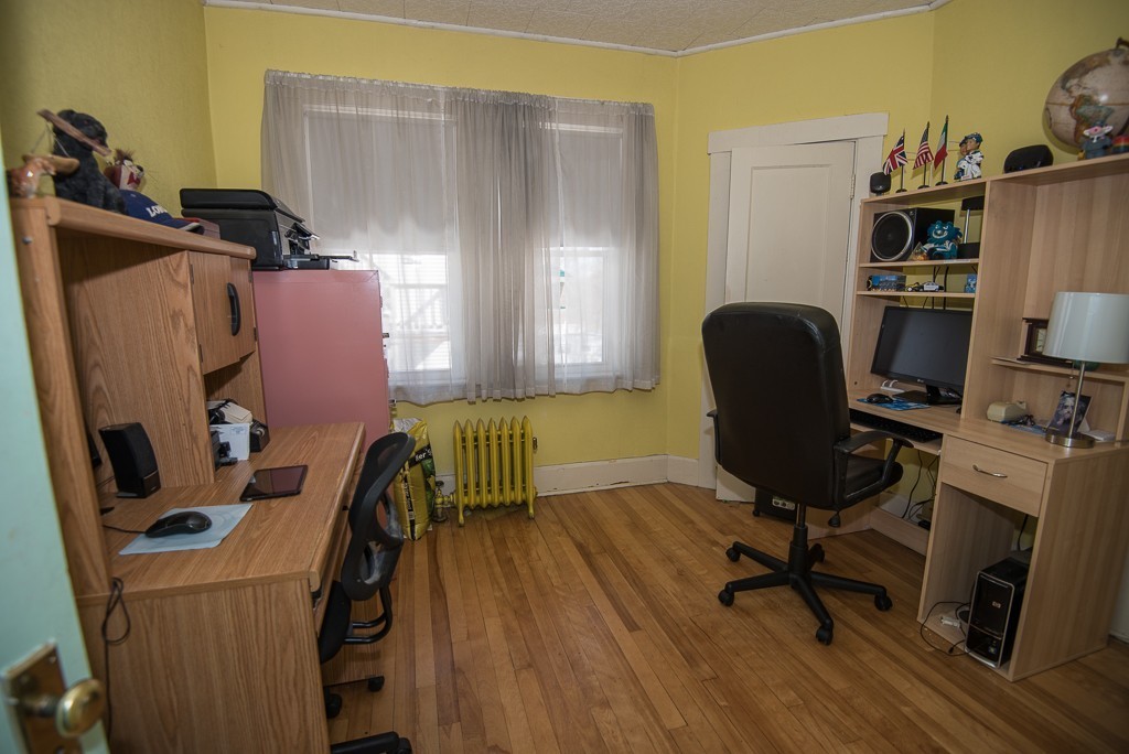 7-9 Boynton Street Clinton, MA 01510 - Photo 10 of 28 a view of a workspace with furniture and a window