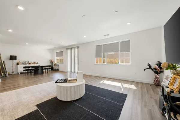 a living room with furniture and a table