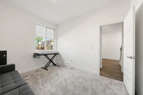 a view of a livingroom with furniture and a window