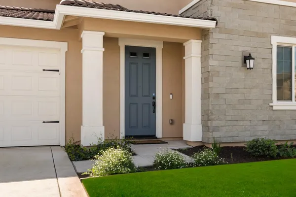 front view of a house with a yard