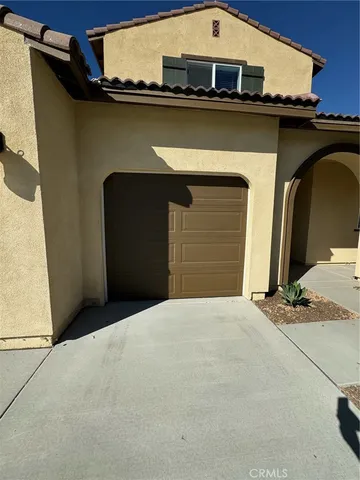 a front view of a house with a garage