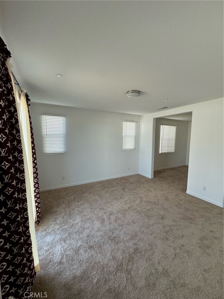 25685 Branson Lane Homeland, CA 92548 - Photo 12 of 13 an empty room with windows