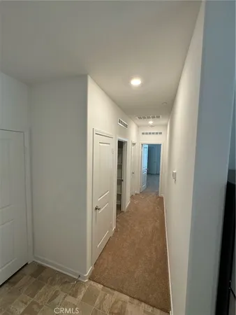 a view of hallway with livingroom