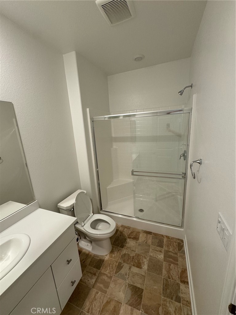 25685 Branson Lane Homeland, CA 92548 - Photo 10 of 13 a bathroom with a sink and a toilet