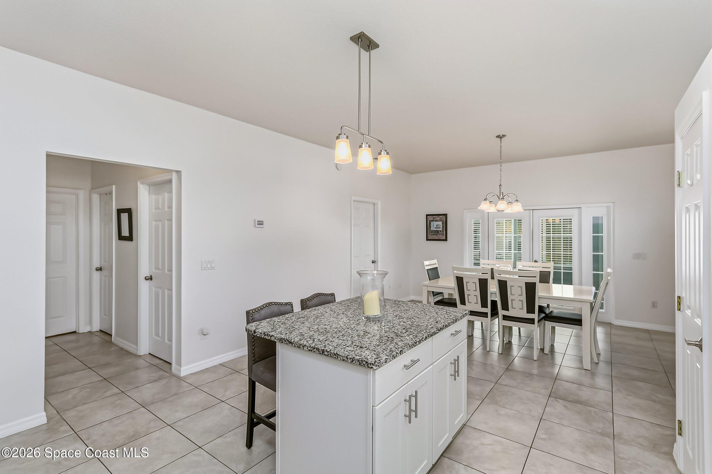 1069 South Fork Circle Melbourne, FL 32901 - Photo 11 of 52 a open kitchen with granite countertop breakfast area