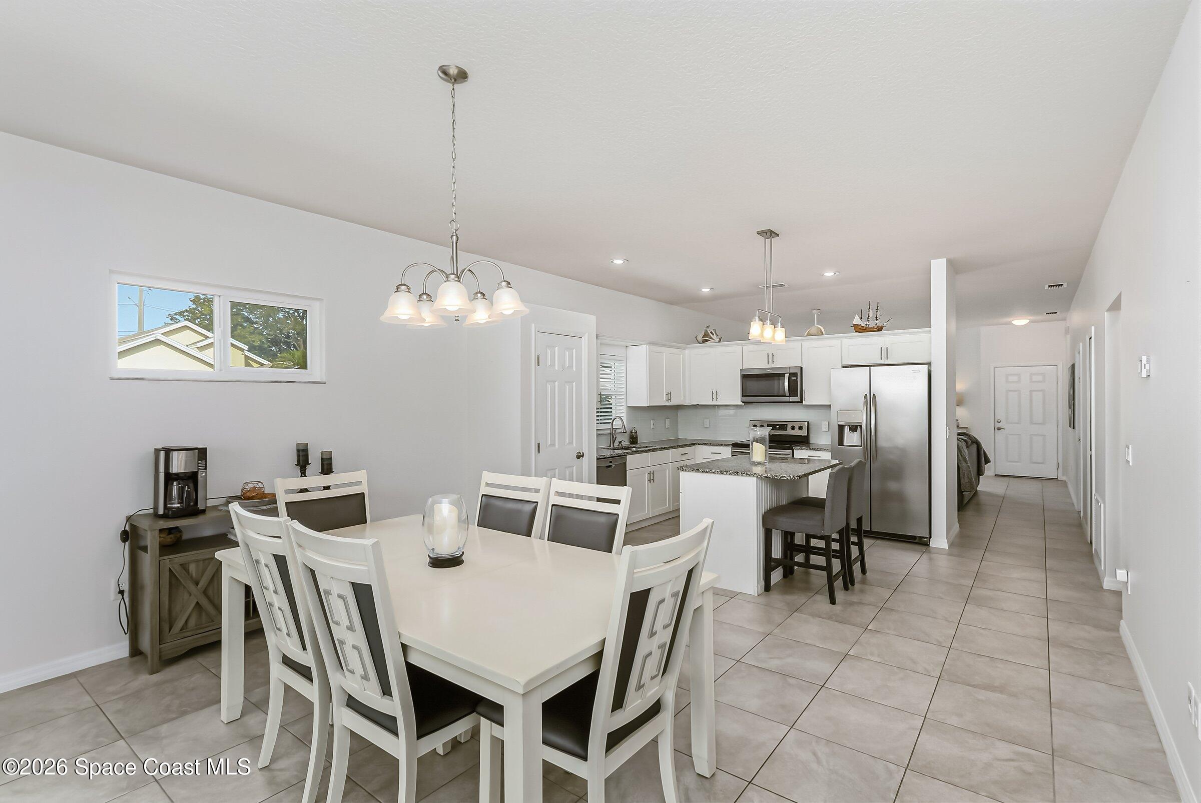 1069 South Fork Circle Melbourne, FL 32901 - Photo 13 of 52 a view of a dining room with furniture