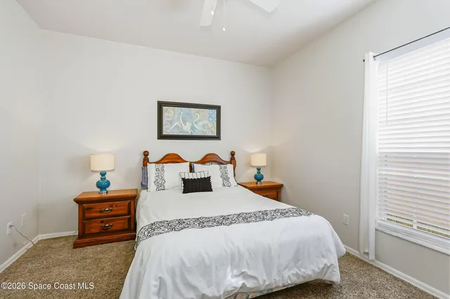 a bed room with a bed and a lamp