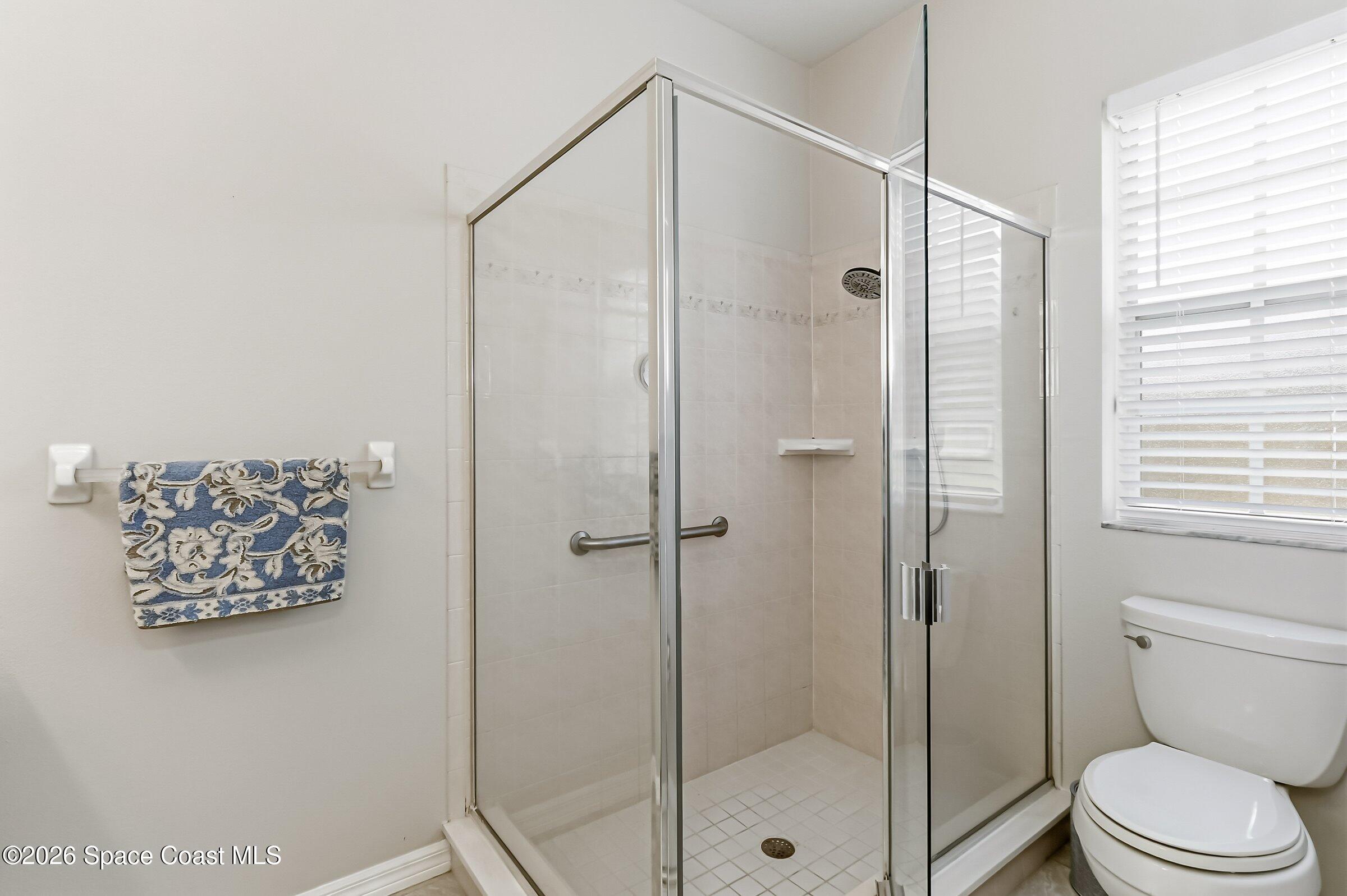 1069 South Fork Circle Melbourne, FL 32901 - Photo 20 of 52 a bathroom with a shower and a toilet