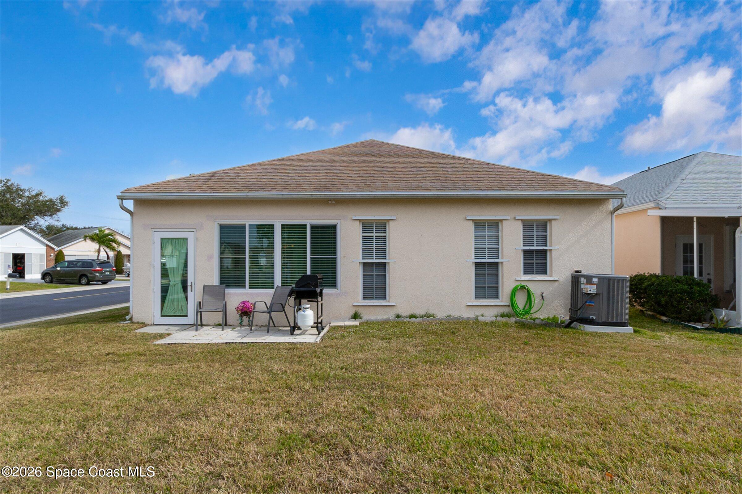 1069 South Fork Circle Melbourne, FL 32901 - Photo 25 of 52 a front view of house with yard and seating space