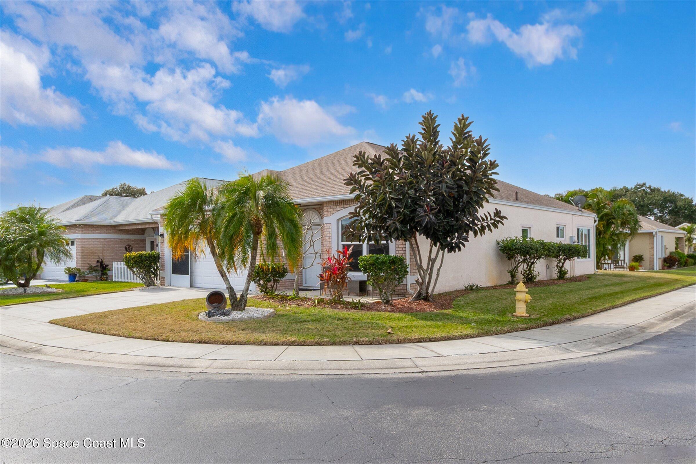 1069 South Fork Circle Melbourne, FL 32901 - Photo 27 of 52 a view of a fountain in front of a house