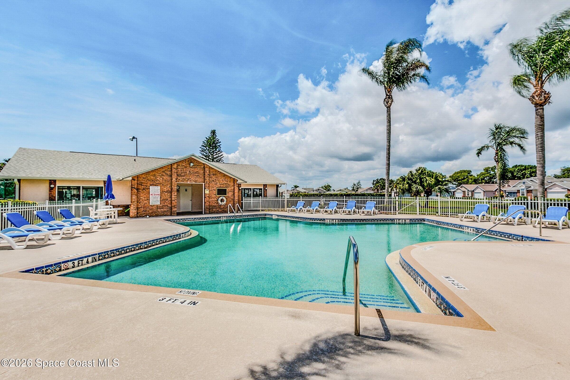 1069 South Fork Circle Melbourne, FL 32901 - Photo 29 of 52 a front view of a house with garden