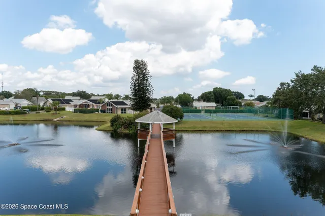 a view of a swimming pool with a yard