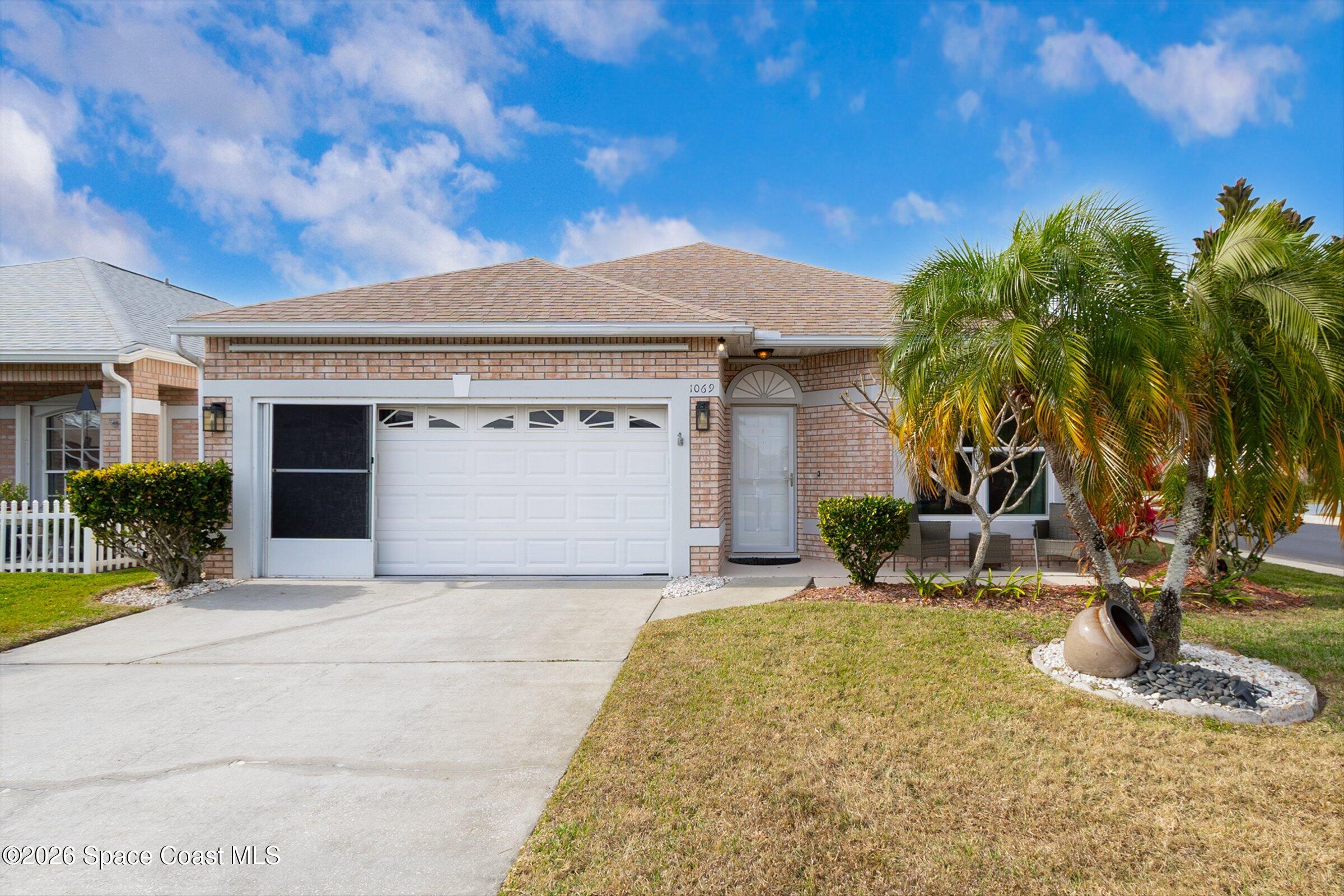 1069 South Fork Circle Melbourne, FL 32901 - Photo 7 of 52 a view of a house with a patio