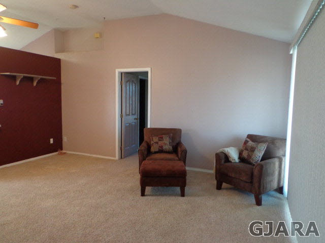 1809 L Road Fruita, CO 81521 - Photo 2 of 19 a living room with furniture and a window