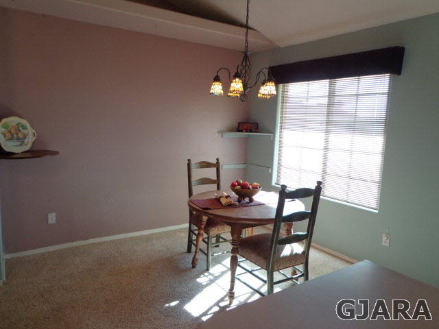 1809 L Road Fruita, CO 81521 - Photo 4 of 19 a view of a dining room with furniture and window