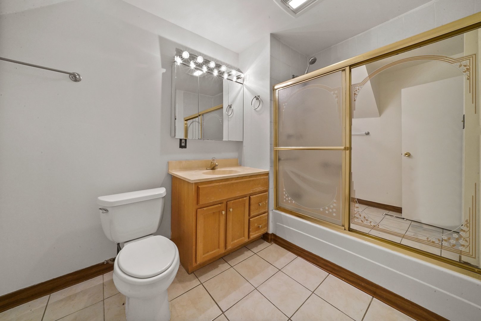1154 West 17th Street Chicago, IL 60608 - Photo 11 of 35 a bathroom with a sink a toilet and shower