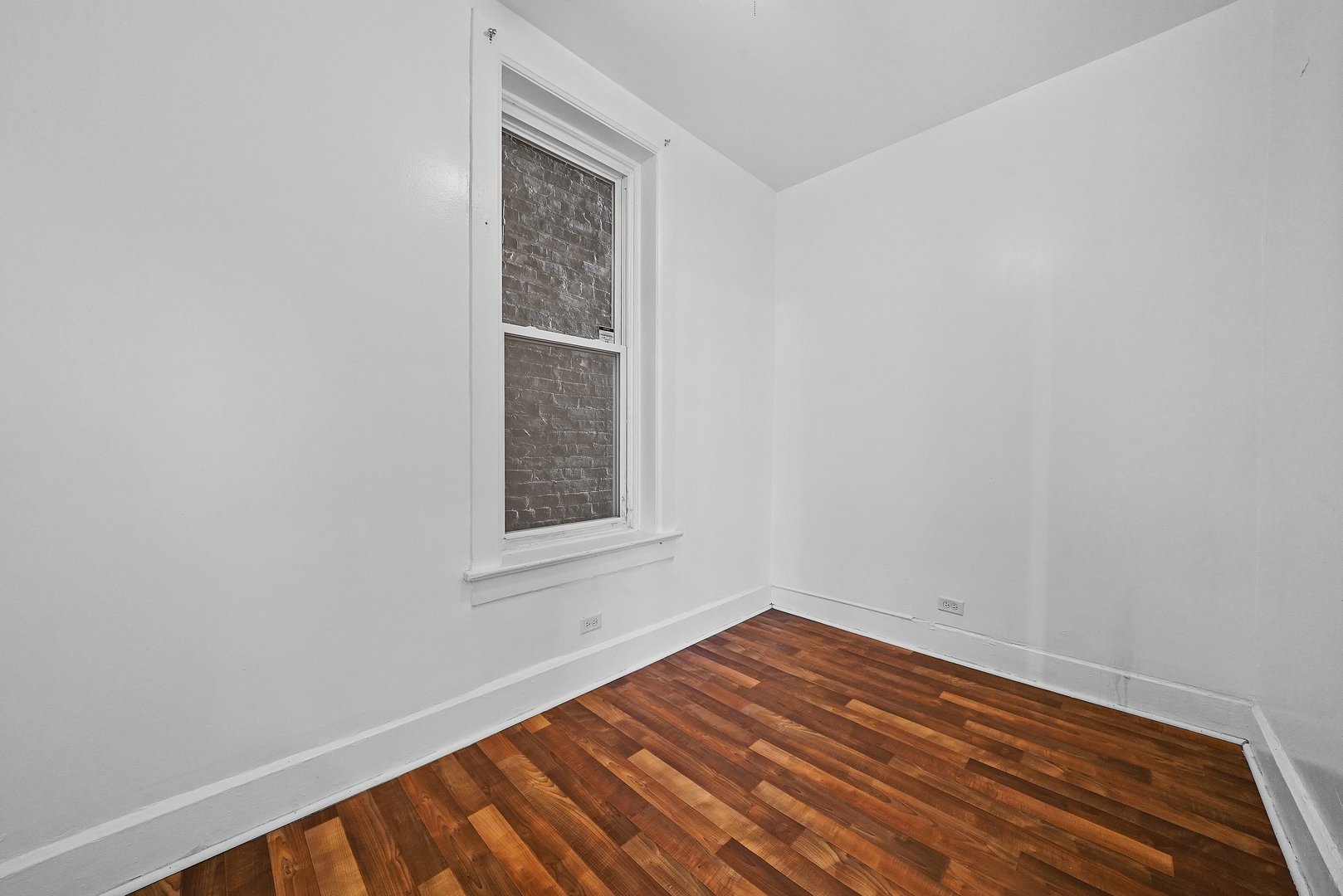 1154 West 17th Street Chicago, IL 60608 - Photo 14 of 35 a view of empty room with wooden floor and fan