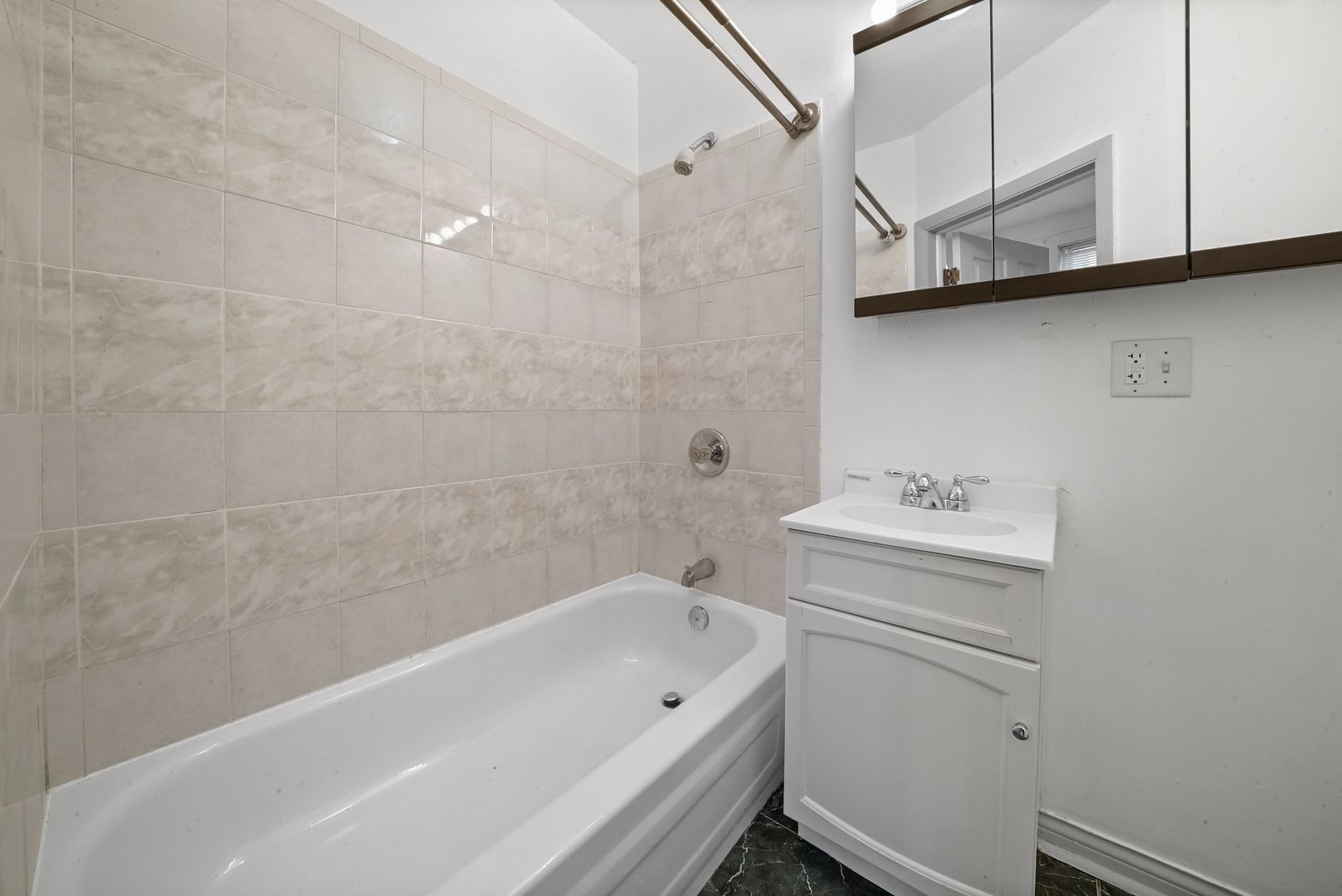 1154 West 17th Street Chicago, IL 60608 - Photo 19 of 35 a bathroom with a sink a bath tub and a shower