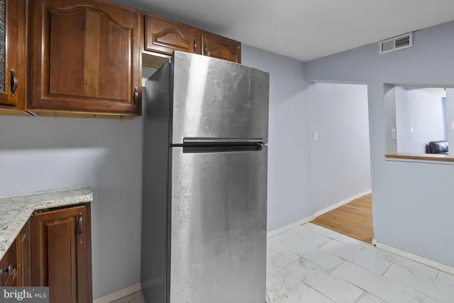 a refrigerator freezer sitting in a kitchen