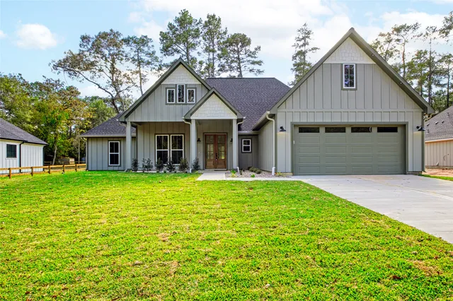 a front view of a house with a garden and porch