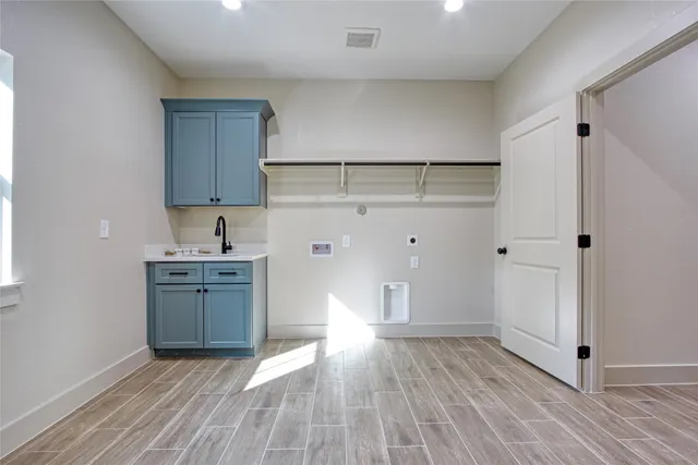 a view of a storage & utility room with windows