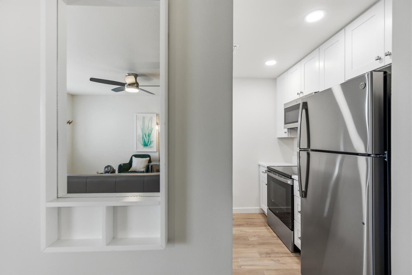 4139 North 27th Street, Unit 2 Phoenix, AZ 85016 - Photo 11 of 31 a kitchen with stainless steel appliances a refrigerator and a sink