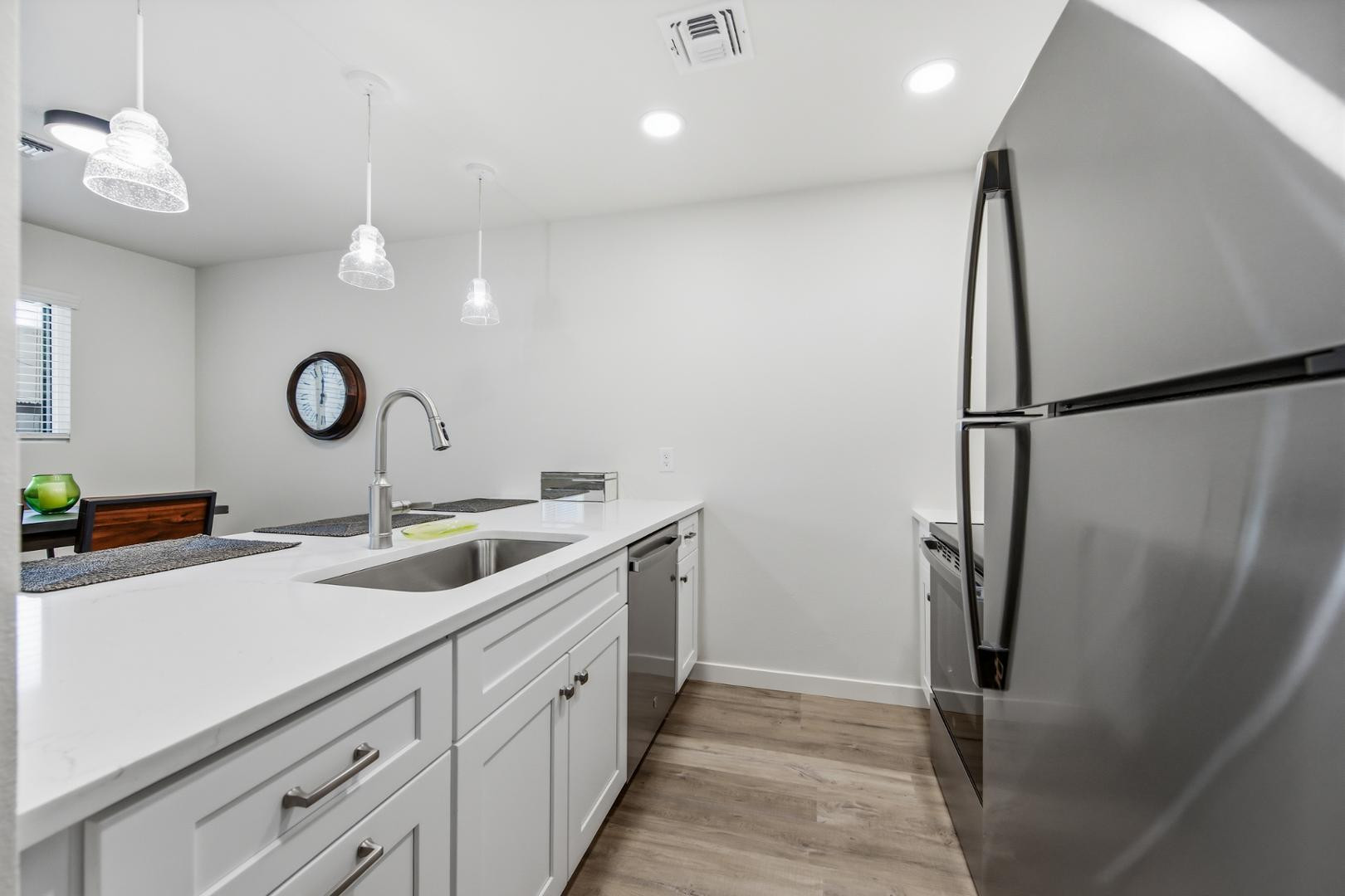 4139 North 27th Street, Unit 2 Phoenix, AZ 85016 - Photo 12 of 31 a kitchen with a sink and refrigerator