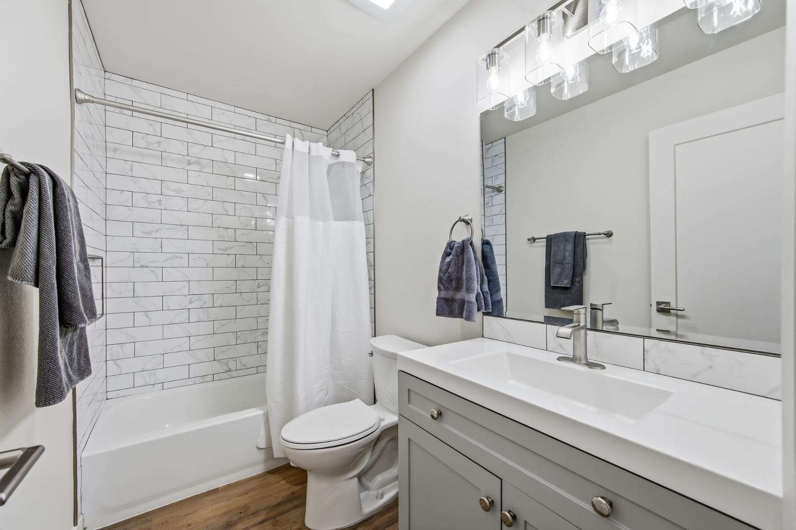 4139 North 27th Street, Unit 2 Phoenix, AZ 85016 - Photo 16 of 31 a bathroom with a sink a toilet and shower