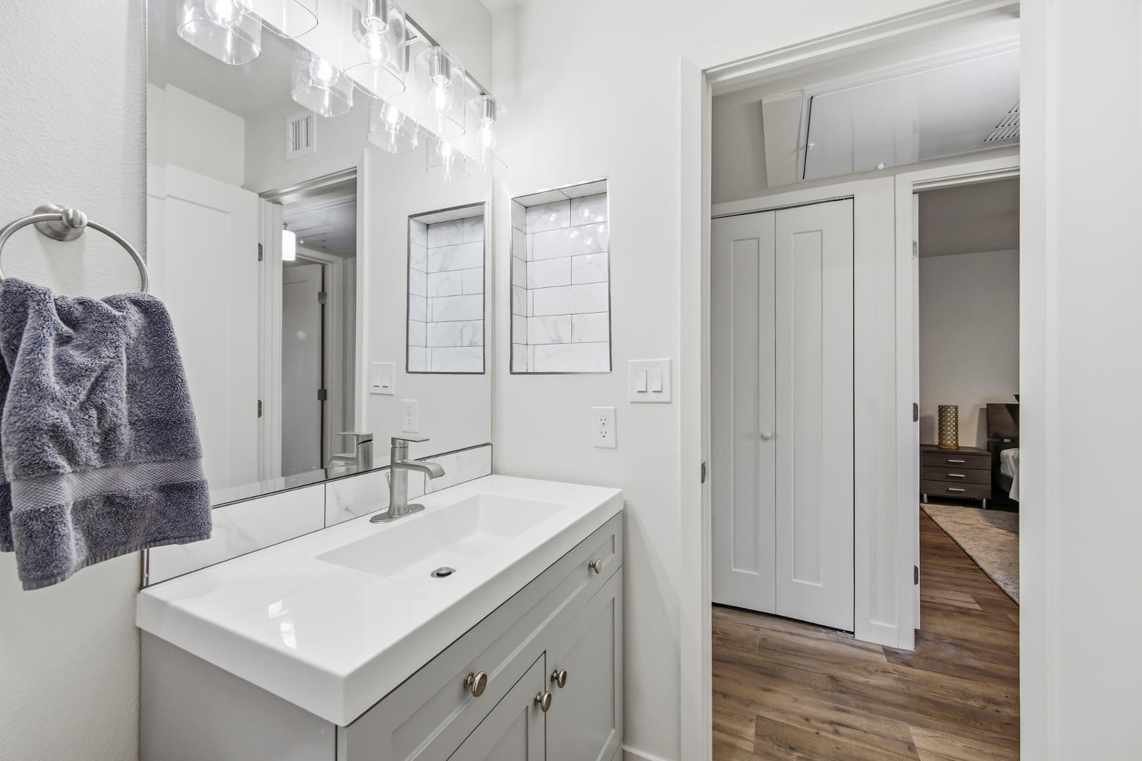 4139 North 27th Street, Unit 2 Phoenix, AZ 85016 - Photo 19 of 31 a bathroom with a sink mirror and shower