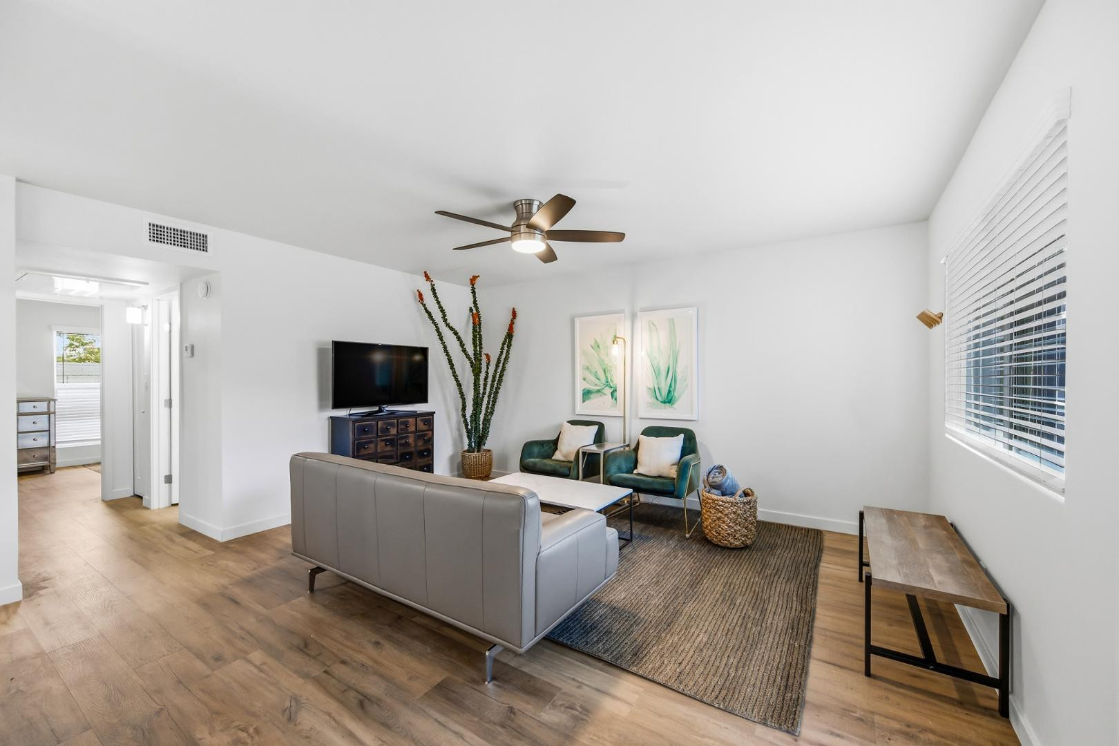4139 North 27th Street, Unit 2 Phoenix, AZ 85016 - Photo 5 of 31 a living room with furniture and a flat screen tv