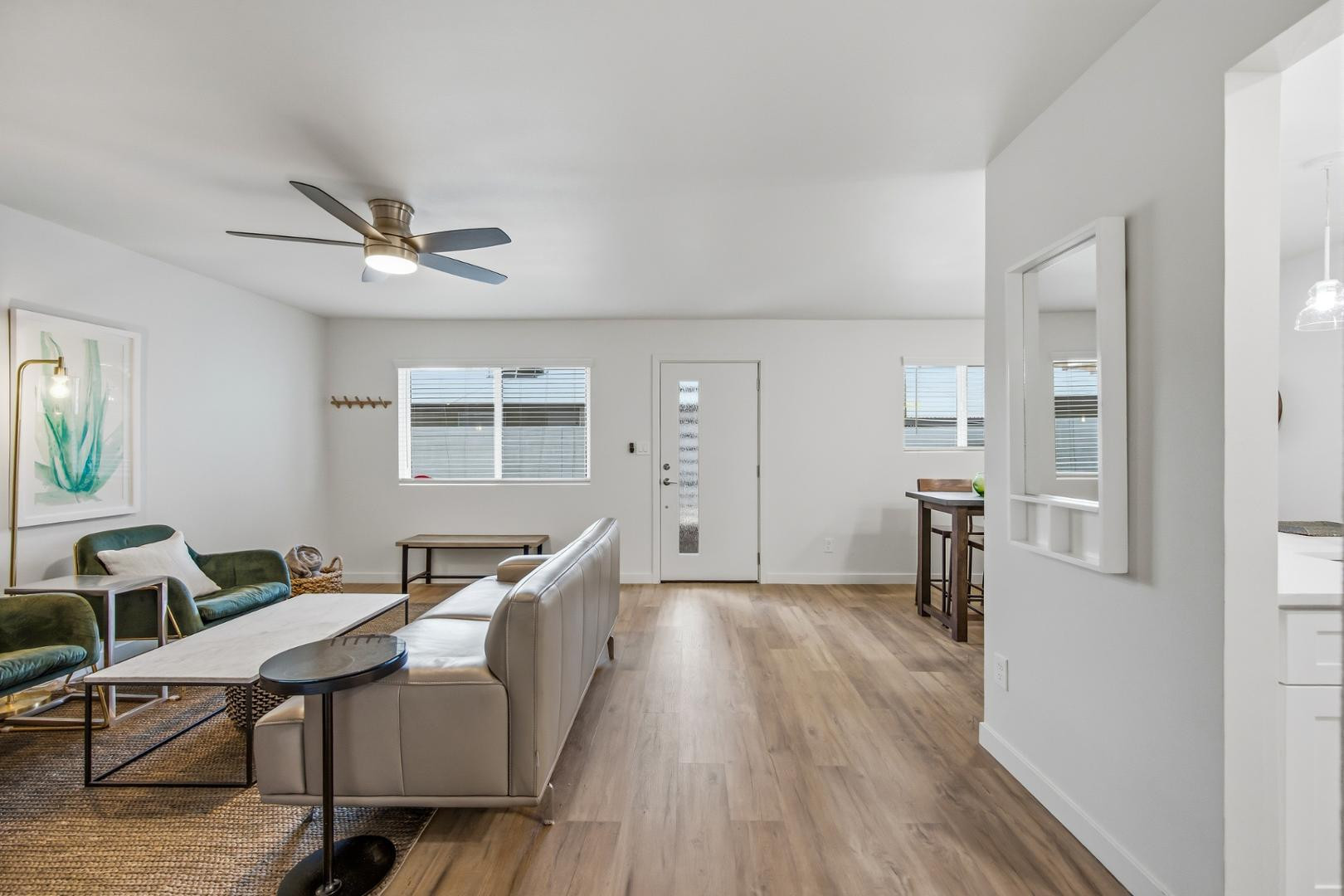 4139 North 27th Street, Unit 2 Phoenix, AZ 85016 - Photo 6 of 31 a living room with furniture a window and wooden floor