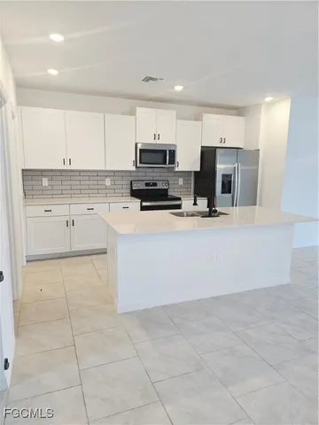 a large kitchen with a cabinets and counter space