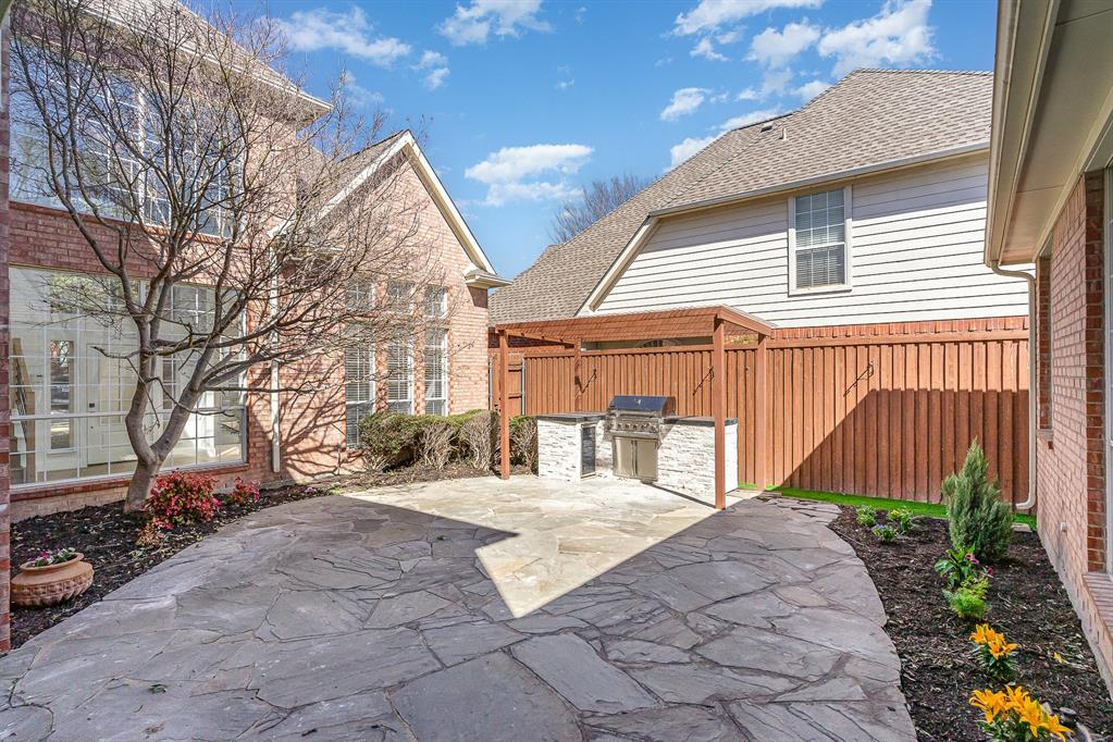 7524 Aberdon Road Dallas, TX 75252 - Photo 27 of 39 View of patio with an outdoor kitchen, fence, and a grill