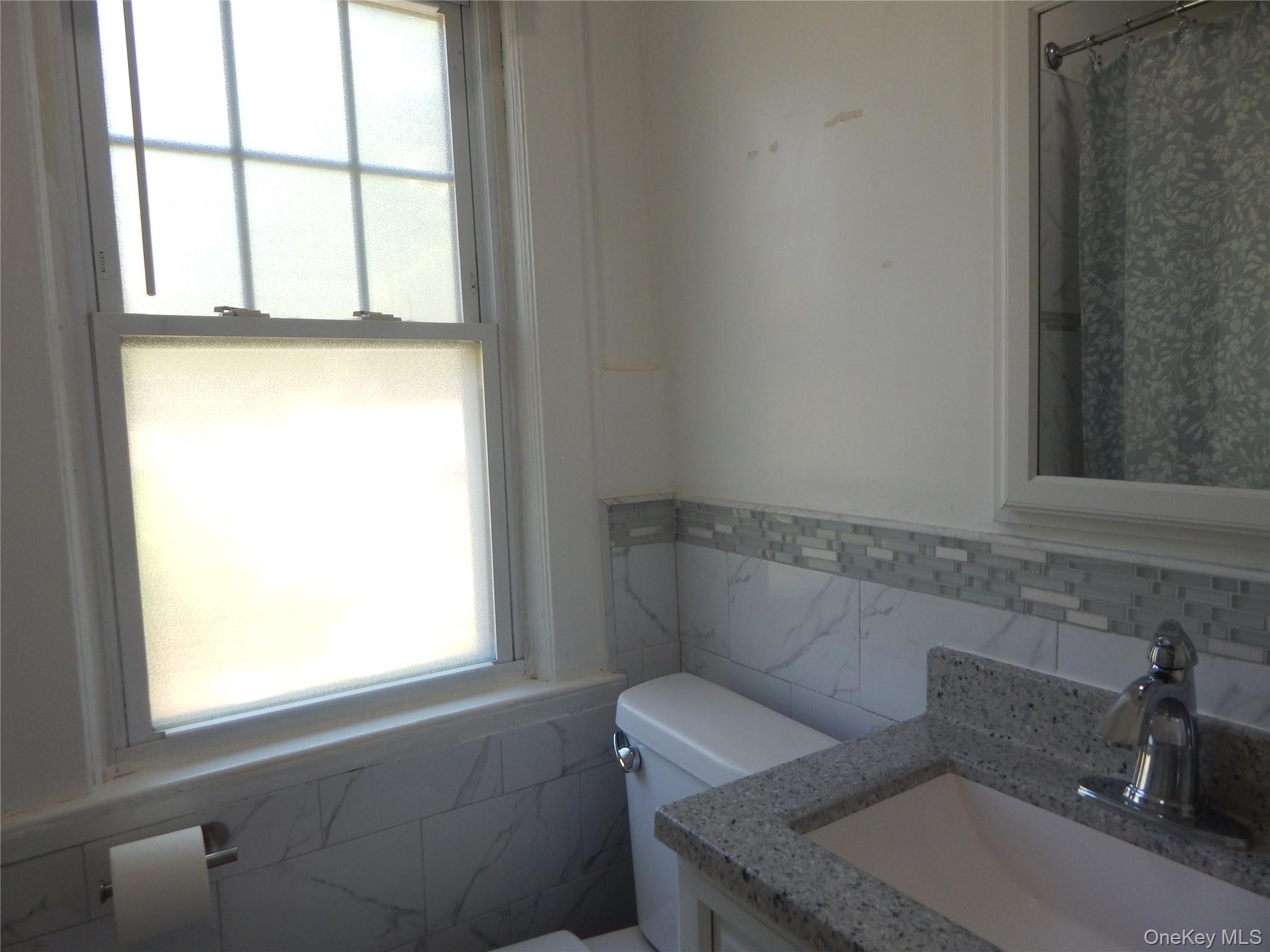 321 Spring Street Ossining, NY 10562 - Photo 11 of 18 Updated Full Bath with shower and bathtub.