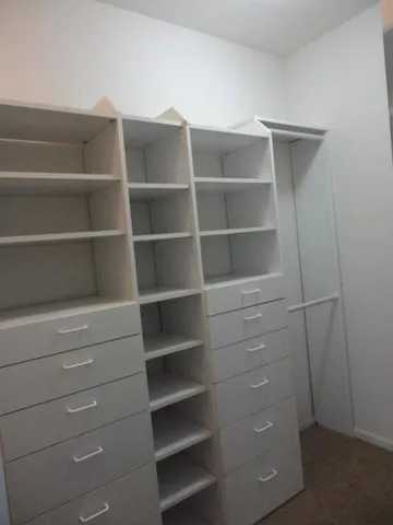 a bathroom with a bathtub and a window