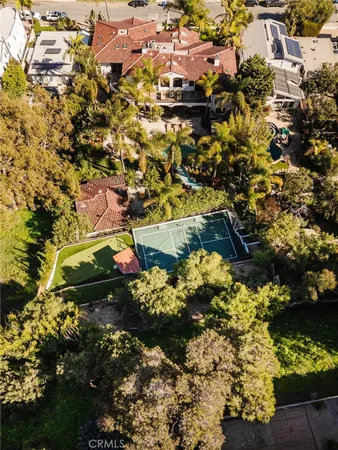 a view of a house with swimming pool and sitting area