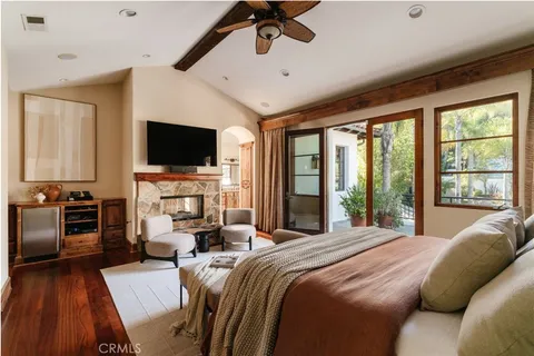 a living room with furniture and large windows