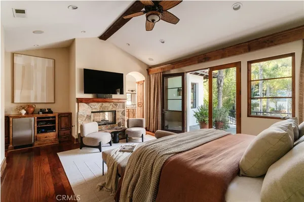 a living room with furniture and large windows