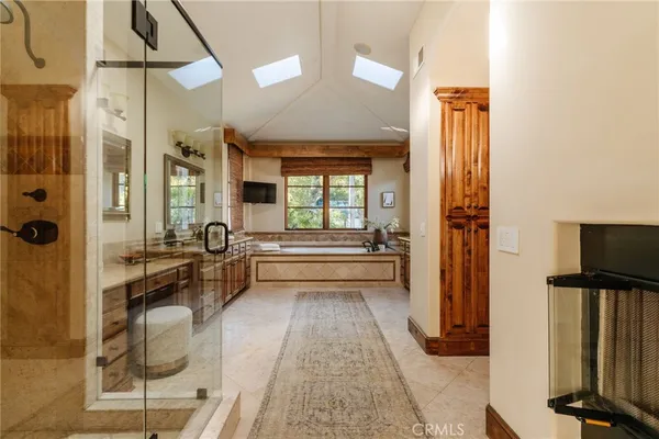 a bathroom with a granite countertop sink a mirror and vanity