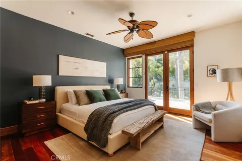 a room with furniture projector and screen