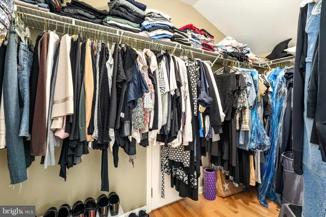 a spacious bathroom with a tub sink and mirror