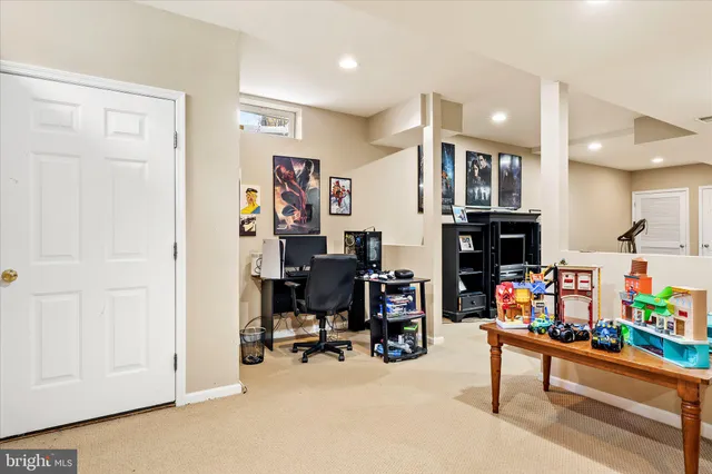 a view of a livingroom with wooden floor and a flat screen tv