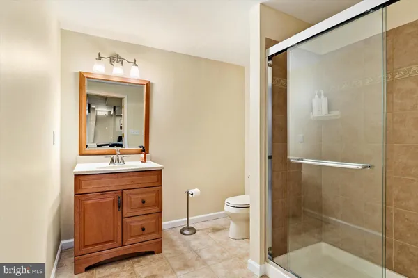 a room with lots of wooden furniture and a rug