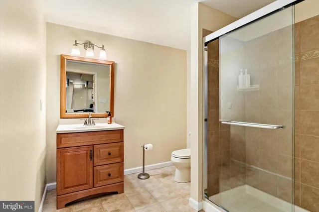 a room with lots of wooden furniture and a rug