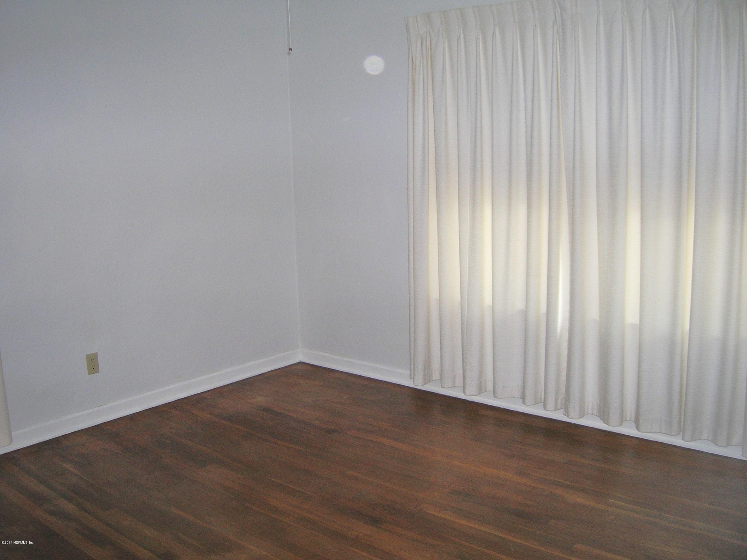 4648 Manchester Road Jacksonville, FL 32210 - Photo 11 of 16 a view of wooden floor in an empty room